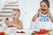 Two kids preschooler eating fresh juicy watermelon and ice-cream