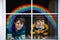 Two kids, school boys, siblings and best friends with rainbow painted with colorful window color during pandemic