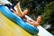 Two kids on water slide