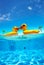 Two kissing half inflatable swimming ducks underwater split shot