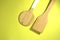 Two kitchen spatulas. On a yellow background. Top view