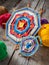 two knitted tibetan mandala from threads and yarn, selective focus