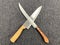 Two knives on a gray background, top view. Ð¡ooking sign - two symmetric crossed knives.