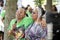 Two ladies are singing and enjoying the outdoor concert