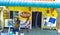 Two ladies sitting infront of small hardware store in Mongu, a small town in Africa