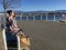 Two ladies sitting on park bench in springtime