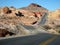 Two-lane road weaving through desert