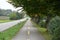 Two lanes cycle path running parallel with a main road.