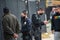 Two LAPD officers making an arrest and questioning a witness.