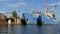 Two large blue old ships. Old fishing port with vintage boats