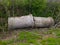 Two large, old concrete culverts was thrown into a ditch