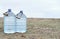 Two large plastic transparent carboys, capacity 5 gallons 19 liter, for water coolers with drinking water on a light background