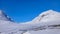 Two large snowy mountains near the polar circle