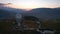 Two large telescope domes at sunset. Drone view