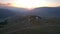 Two large telescope domes at sunset. Drone view