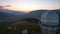 Two large telescope domes at sunset. Drone view