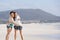 Two laughing girlfriends at the beach