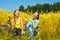 Two laughing pretty girls rest in golden field