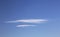 Two Lenticular Clouds on Clear Blue Sky