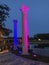 Two lighted pillars by water