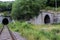 Two-line train tunnel exiting from the mountain 