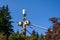 Two linemen working on a wireless communications radio and antenna installation using a bucket truck