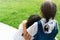 Two little asian girls sisters hugging happy post in school uniform, back to school concept