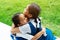 Two little asian girls sisters hugging happy post in school uniform, back to school concept