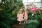 Two little beautiful sisters are walking and having fun in azaleas park