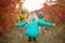 Two little boy run towards his mother,in the autumn sunny day.