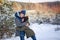 Two little boys friends hug each other in snowy winter day. Brother love