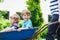 Two little boys having fun in a wheelbarrow