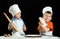 Two little boys making pizza or pasta dough