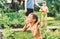 Two little boys playing with water guns on hot summer day. Cute children having fun with water on the backyard. Funny