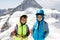 Two little boys with safety helmets and clothing with mountains landscape backgrounds. Kids hiking and discovering