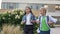 Two little classmates, a boy and a girl, are walking around the school yard in a good mood. School friendship.