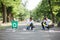 Two little ecologists sitting and collecting plastic rubbish on a blurred park background. Ecology protection concept.