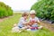 Two little friends, kid boys having fun on raspberry farm