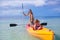 Two little girl and beautiful mother kayaking at