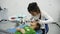 Two little girl play the roles of dentist during a dental check-up