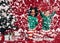 Two little girls in christmas costumes playing with artificial snow flakes. Kids having fun enjoying an artificial snowfall beside