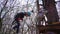 Two little girls climb to the rope Park.