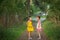Two little girls emotional talking standing in a Park.