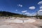 Two little girls exploring the mud pots on the Clear Lake hiking trail near the Grand Canyon of the Yellowstone River