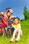 Two little girls fixing bicycles