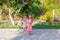 Two little girls on footpath in a tropical country