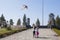 Two little girls fun with colorful flying kite