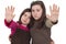 Two little girls gesturing stop