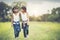 Two little girls hand holding together having fun