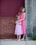 Two Little Girls in Pink Dresses